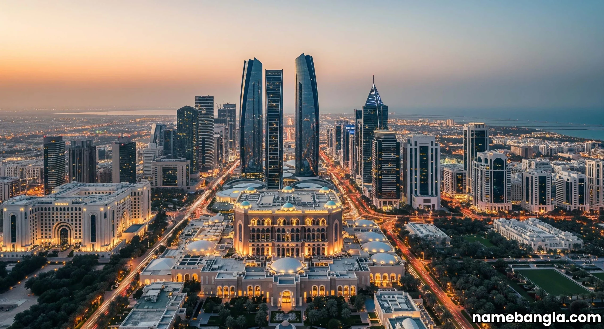 Aerial view of Abu Dhabi's modern skyline with illuminated luxury hotels at dusk, showcasing architectural grandeur.