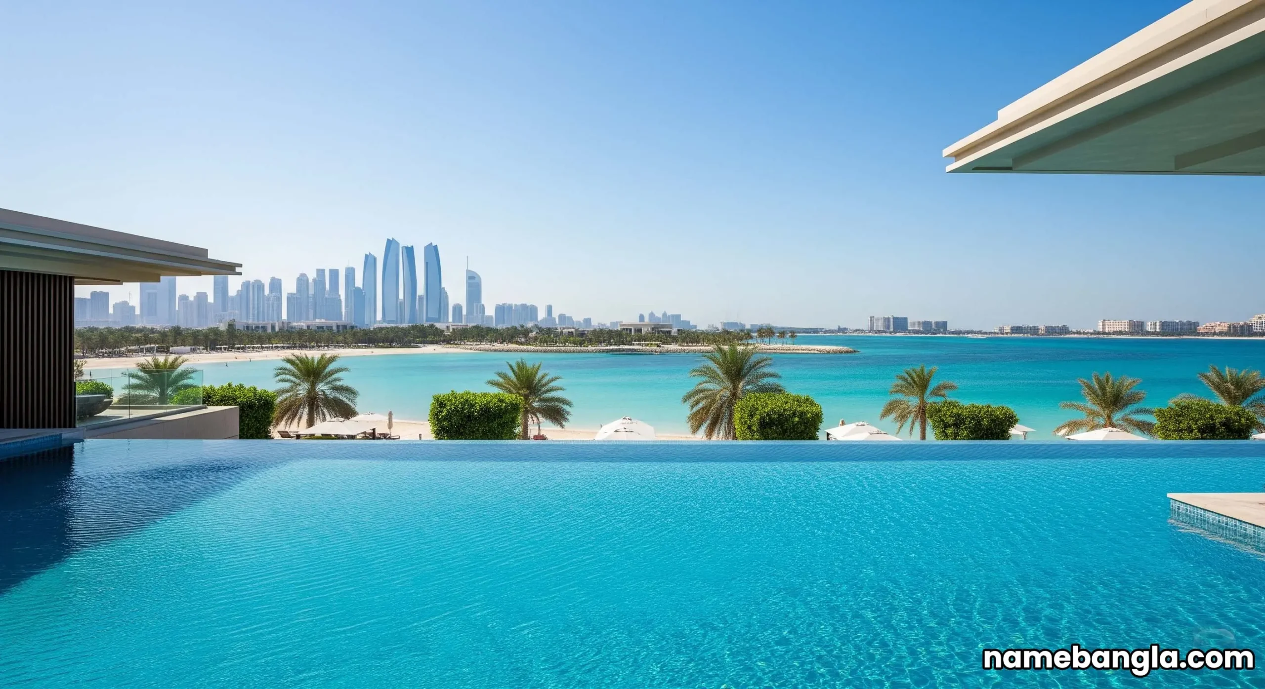 Infinity pool at a luxury Abu Dhabi beachfront resort, overlooking clear turquoise waters and private beach.