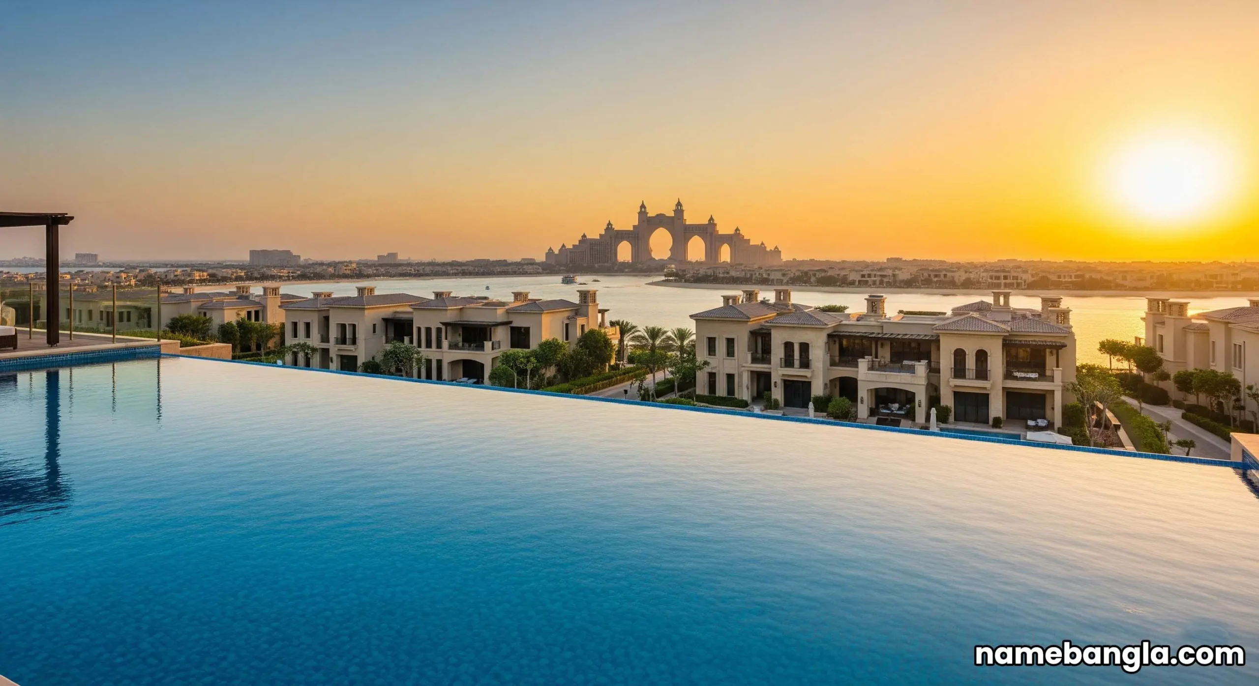 Infinity pool overlooking luxury Palm Jumeirah villas, emphasizing exclusivity.