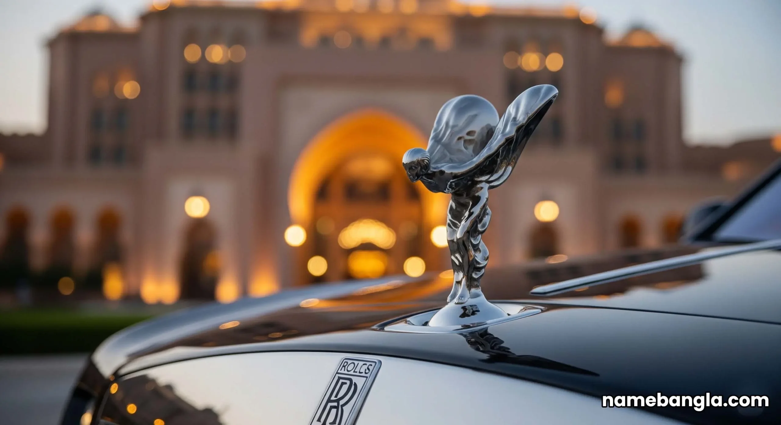 An elite Rolls-Royce luxury car is parked under the grand main archway of the Emirates Palace Mandarin Oriental in Abu Dhabi.