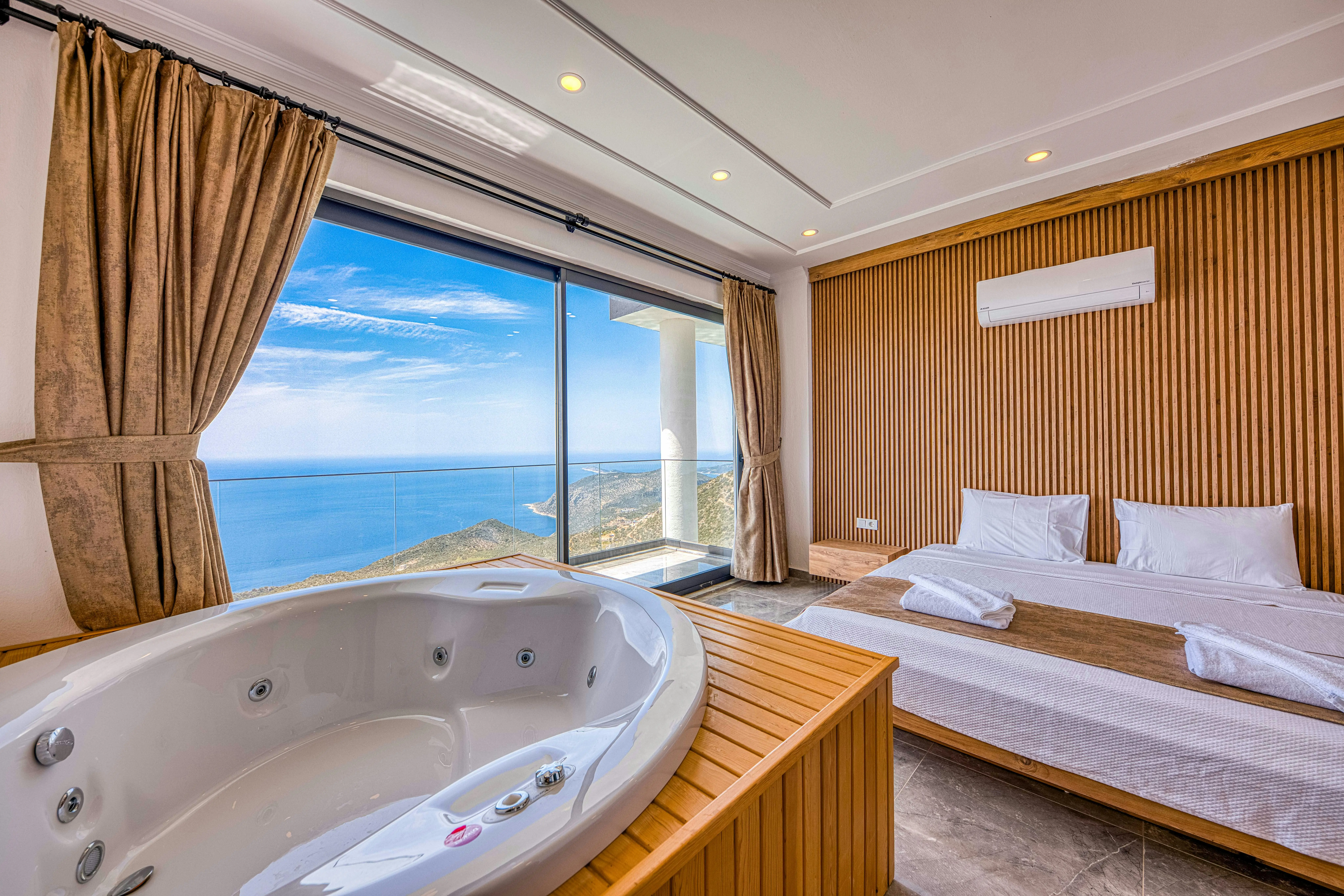 The living room of a Panoramic Suite at Burj Al Arab, showing the 180-degree windows and luxury decor.