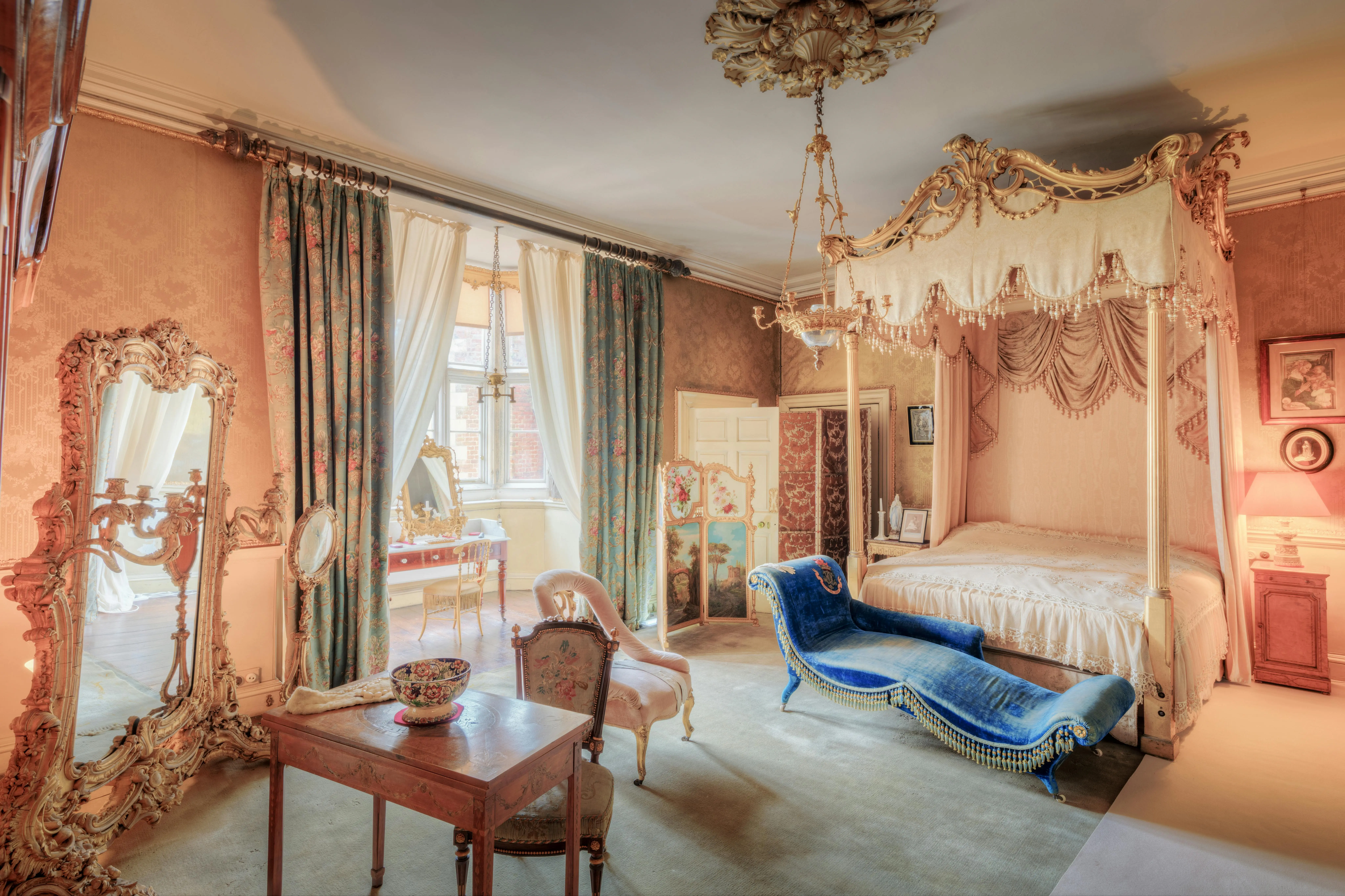 The opulent master bedroom of the Royal Suite at Burj Al Arab, featuring the famous rotating bed and lavish decor.