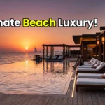 A breathtaking exterior view of the luxurious Nobu by the Beach pool and cabanas at Atlantis The Royal Dubai at sunset.